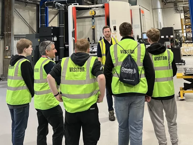 Apprentices listening to leader